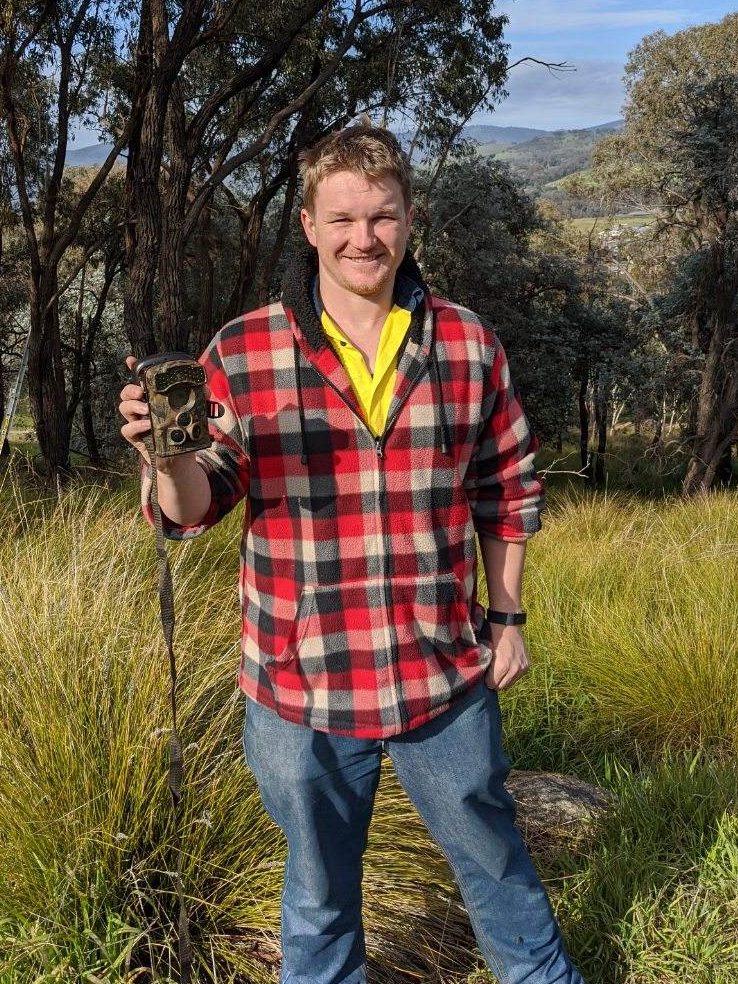 Chris Allen getting ready to install one of our motion sensing cameras at one of 48 monitoring sites across Wodonga, Victoria.